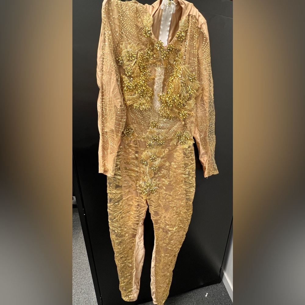 Customized gold jumpsuit worn for a few hours